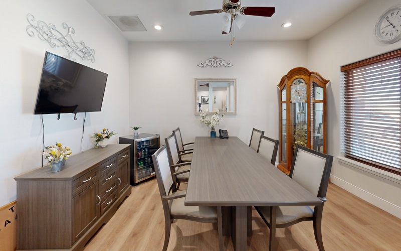 a dining room table with chairs